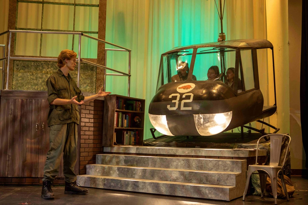 Man preforming on stage.